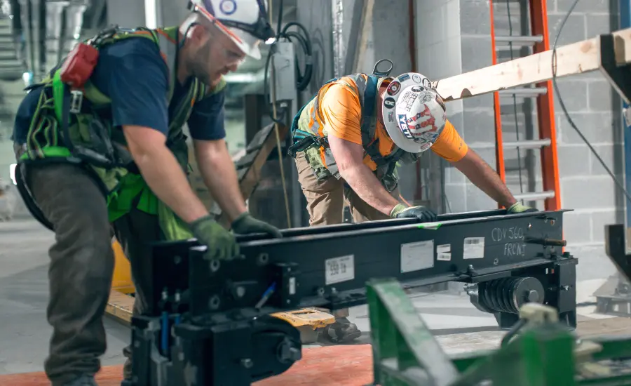 TK Elevator installation team working on elevator equipment