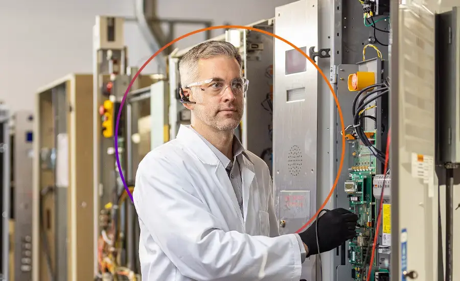 TK Elevator technical specialist diagnosing elevator equipment
